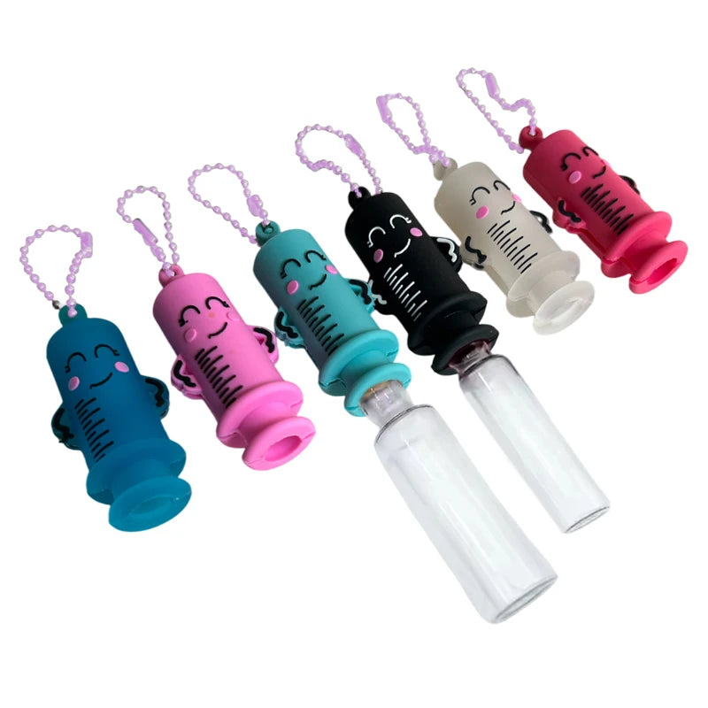 Ampoule opener keychains beside clear glass ampoules