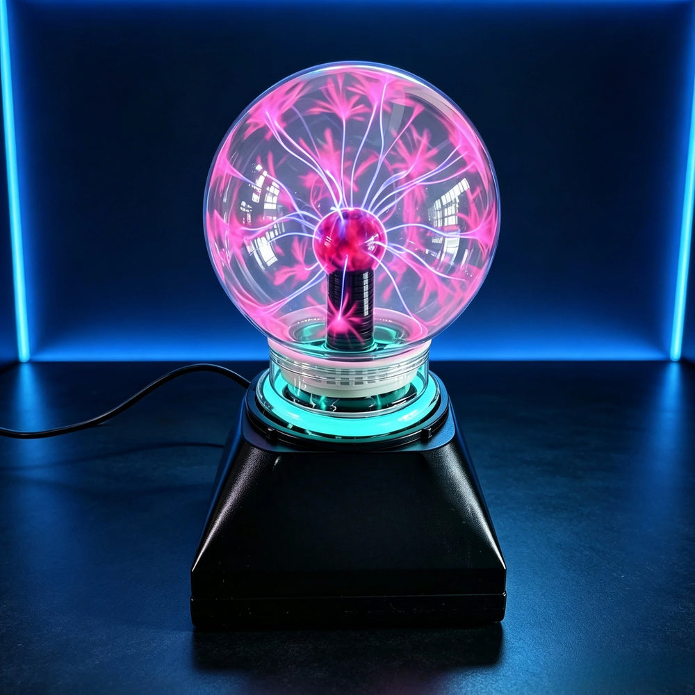 Plasma globe lit with pink filaments on its black base