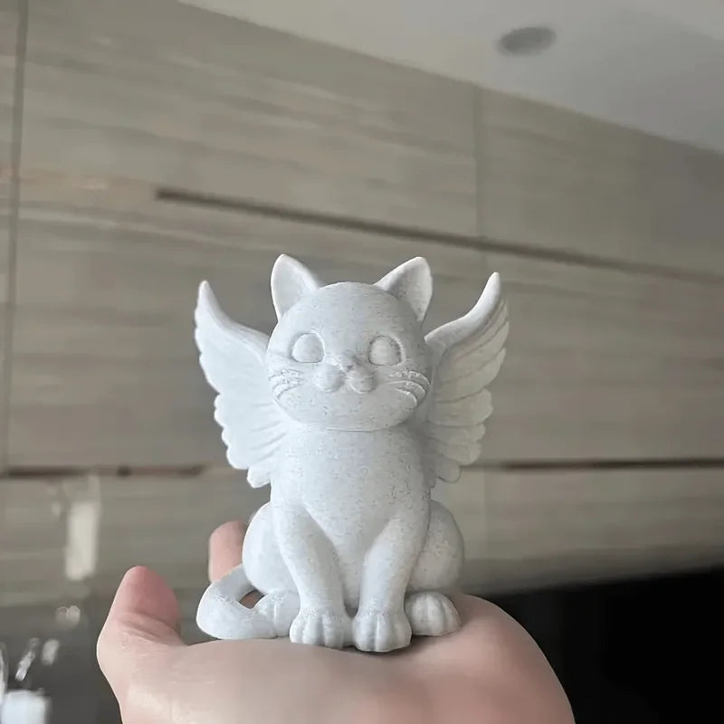 Estatua de gato ángel con alas
