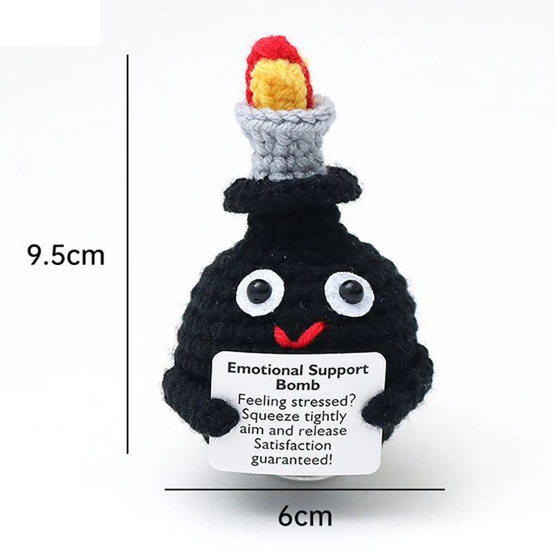 Crochet positive affirmation doll holding an encouragement card