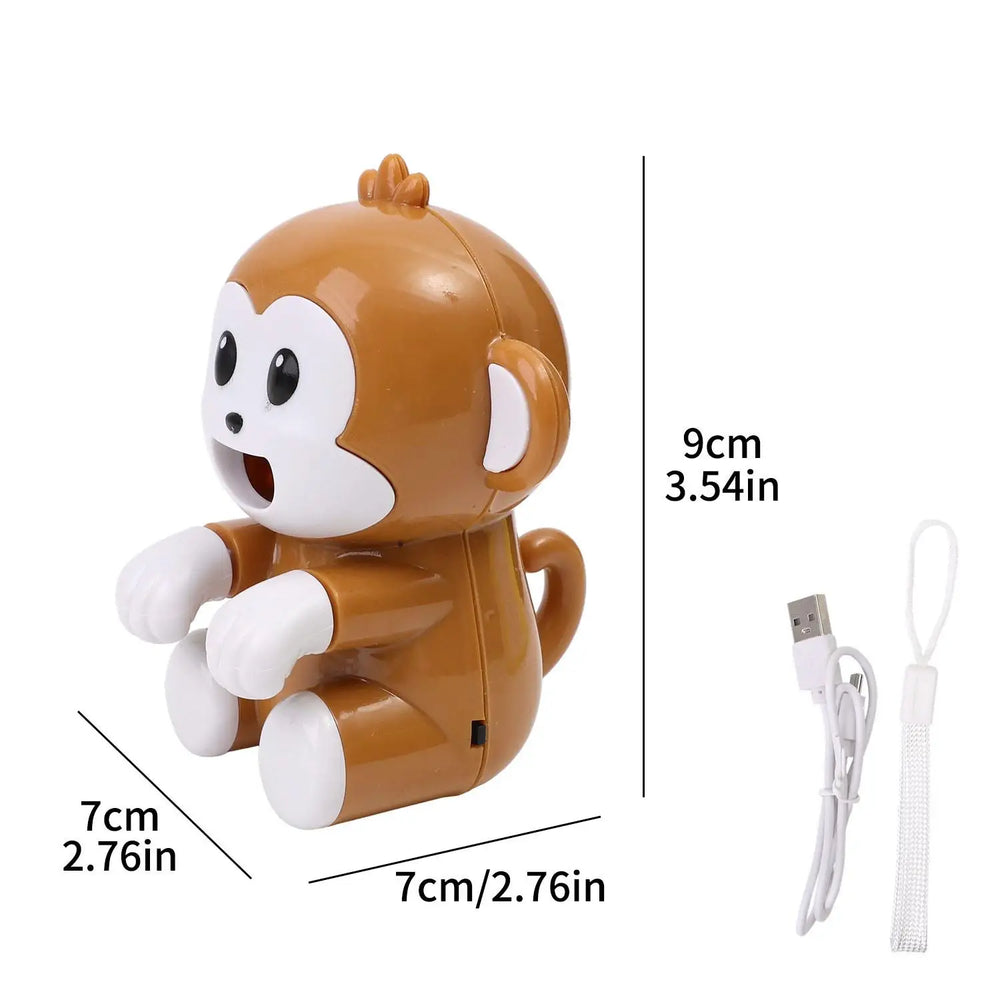 Maker size card: the monkey measured 9cm / 3.54in tall, 7cm / 2.76in wide and 7cm / 2.76in deep, shown beside a white USB cable and a white wrist strap