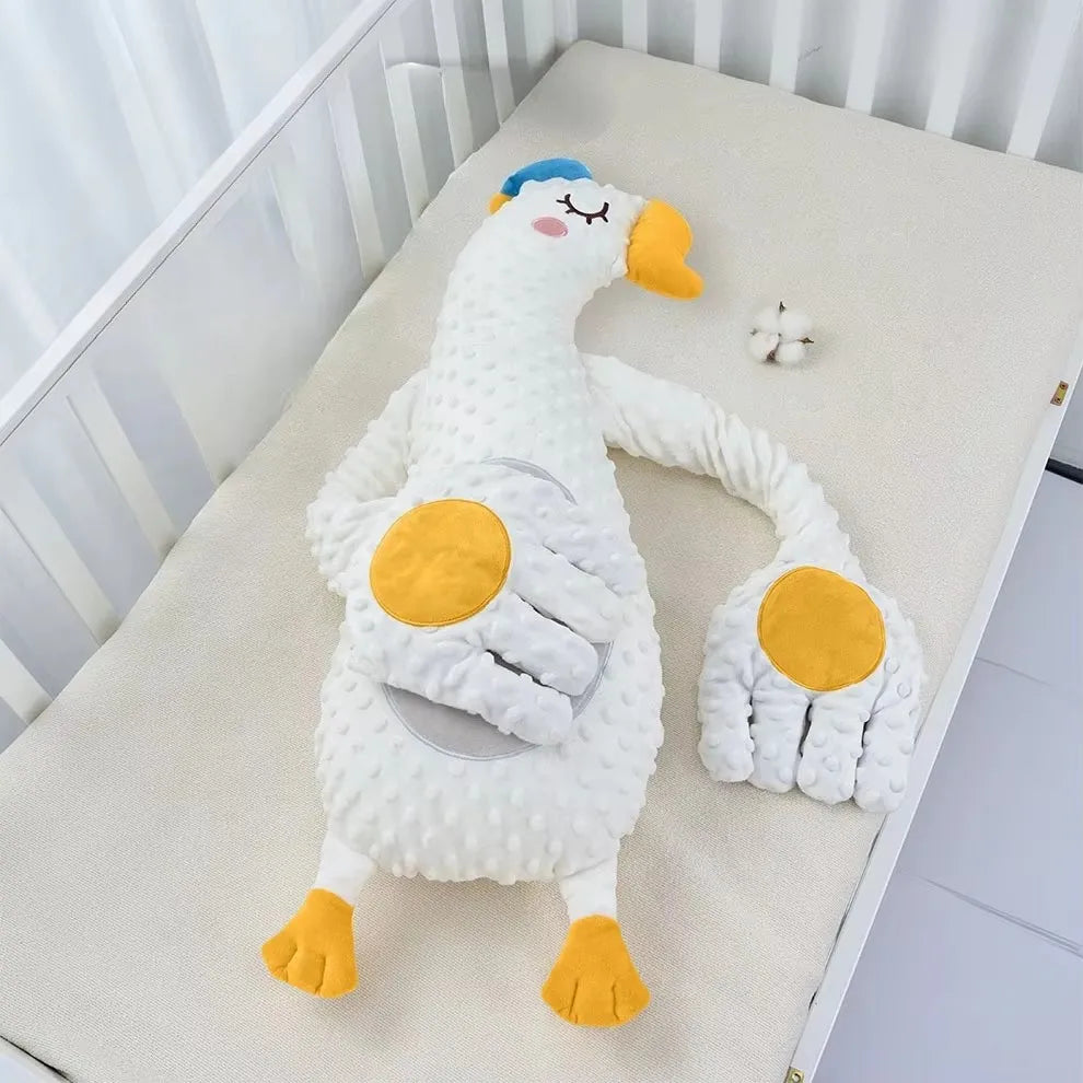 Close view of the white goose design showing the round pad on the arm and the seam where the motor unit sits