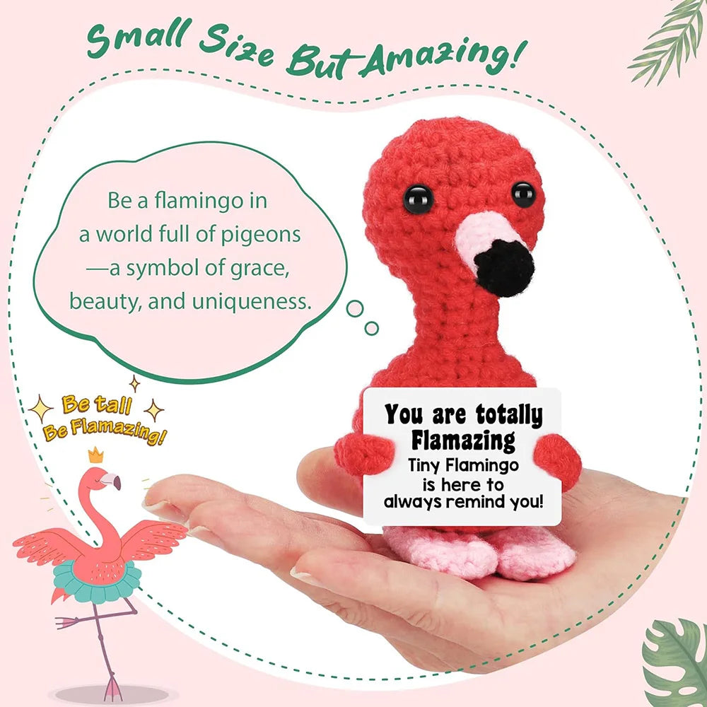 Crochet positive affirmation doll holding an encouragement card