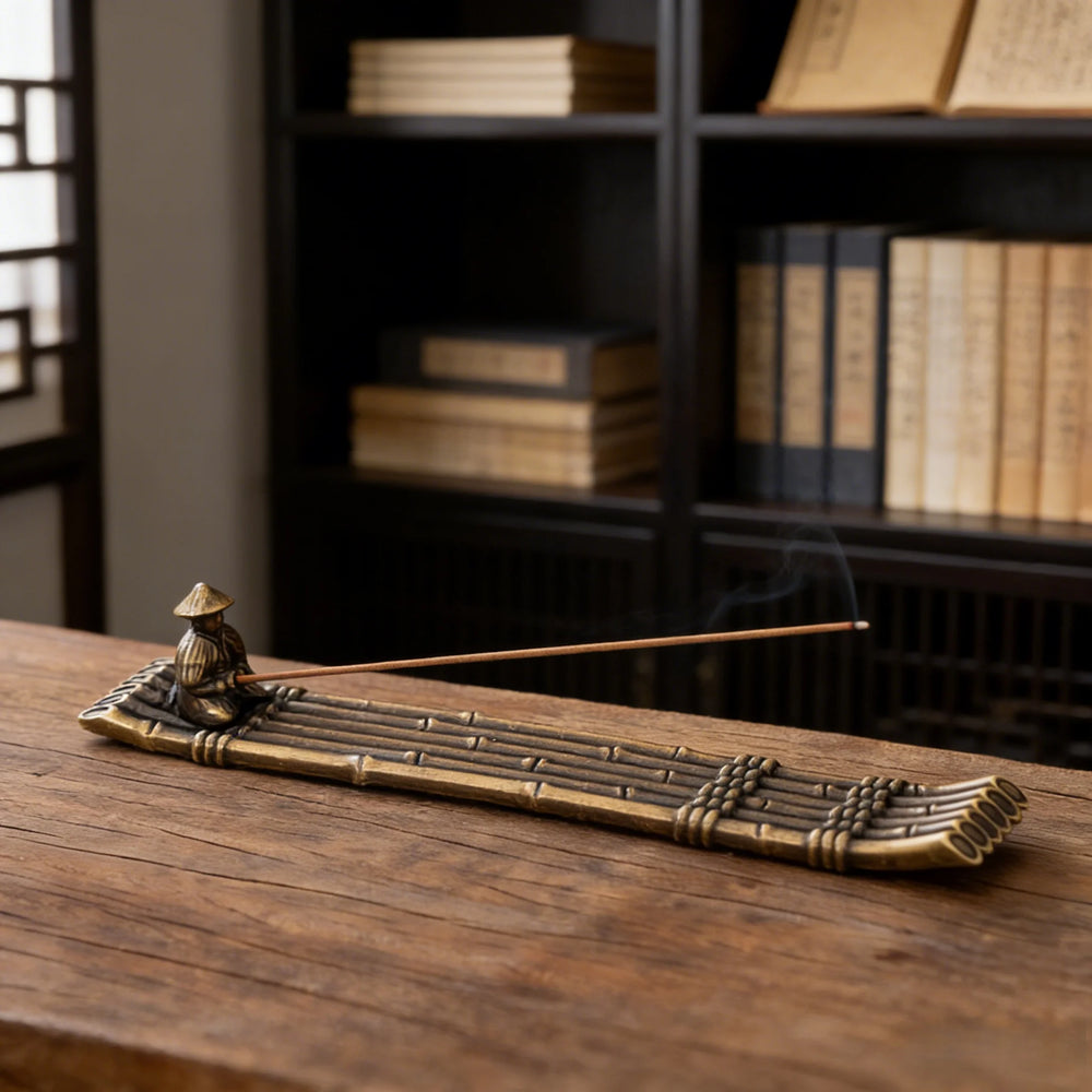 The raft holder on a table in front of a bookcase