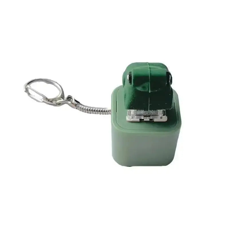 The green keychain photographed on a plain white background, attached by a braided wire loop rather than a chain