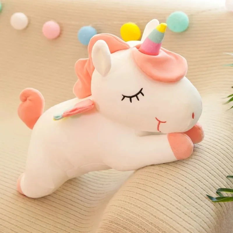 The white unicorn with a pink mane and a rainbow-striped horn