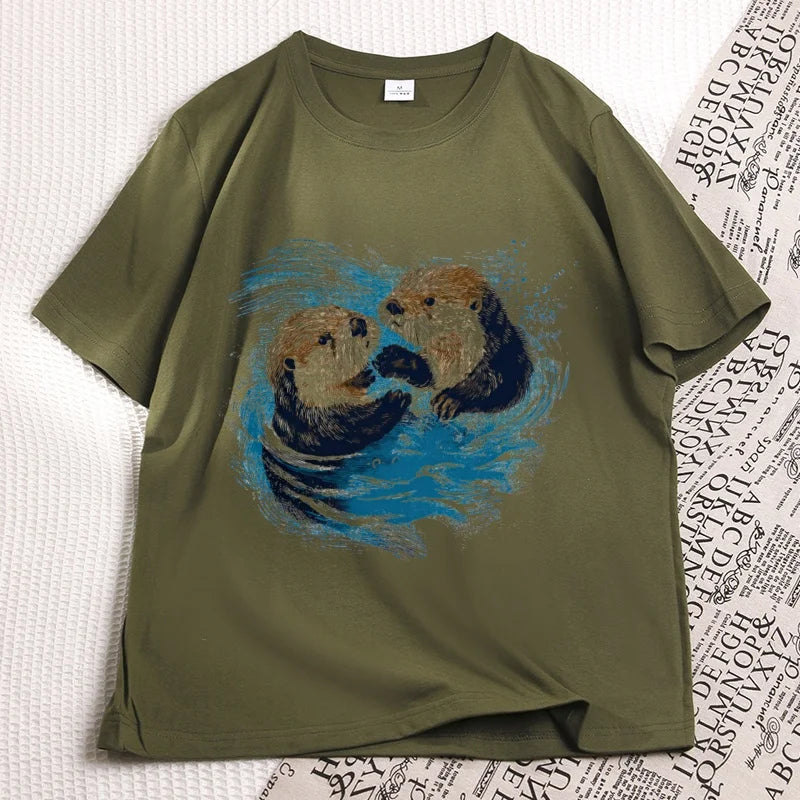 Army green sea otter tee laid flat, two otters printed on the chest