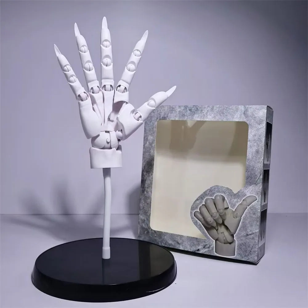 White right hand model with the fingers spread, on its stand beside the window box