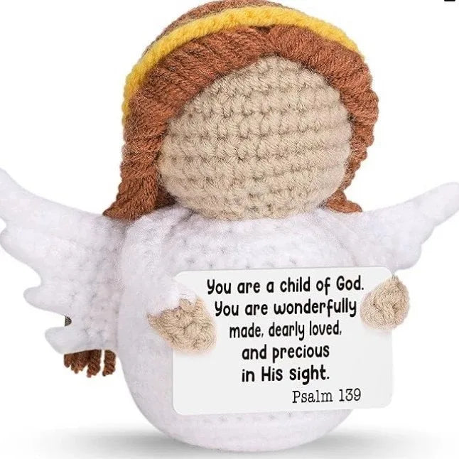 Crochet positive affirmation doll holding an encouragement card