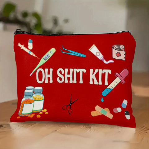 Red zip pouch printed with cartoon medical supplies and the words OH SHIT KIT, standing on a wooden table