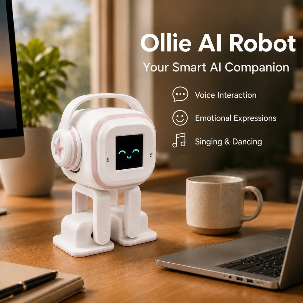 White and pink desk robot with headphones and a smiling screen face standing on a wooden desk beside a mug and a laptop