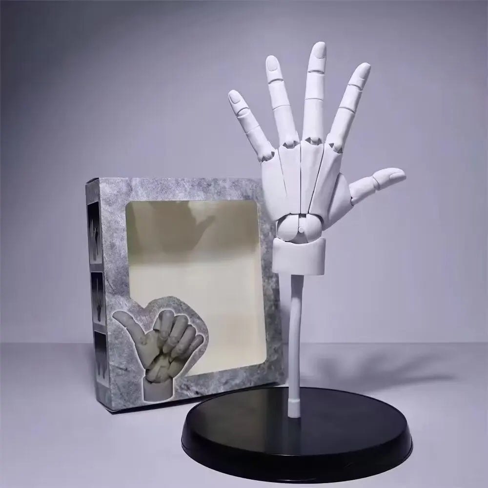 White left hand model with the fingers spread, on its stand beside the window box