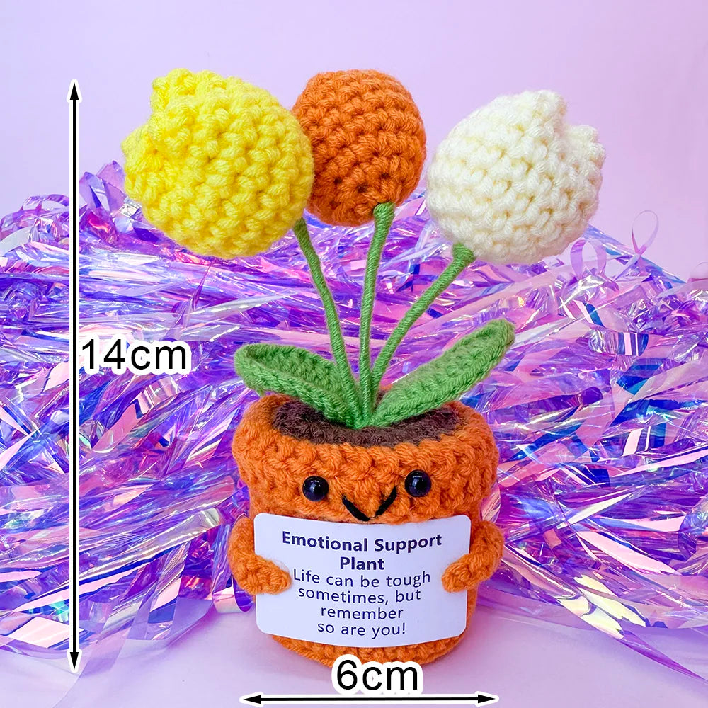 Crochet positive affirmation doll holding an encouragement card