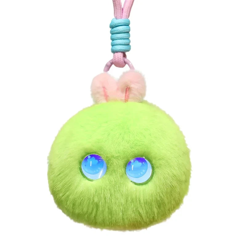 Bright green fluffy pom-pom charm with two round blue light-up eyes, small pink ears and a pink and teal braided cord