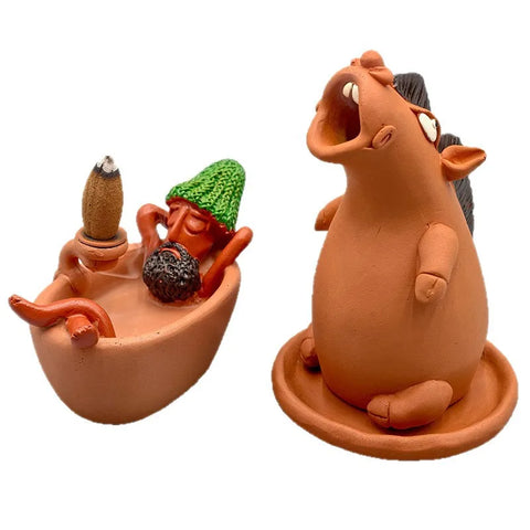 Terracotta resin howling horse and a small man sitting in a tub, plain background