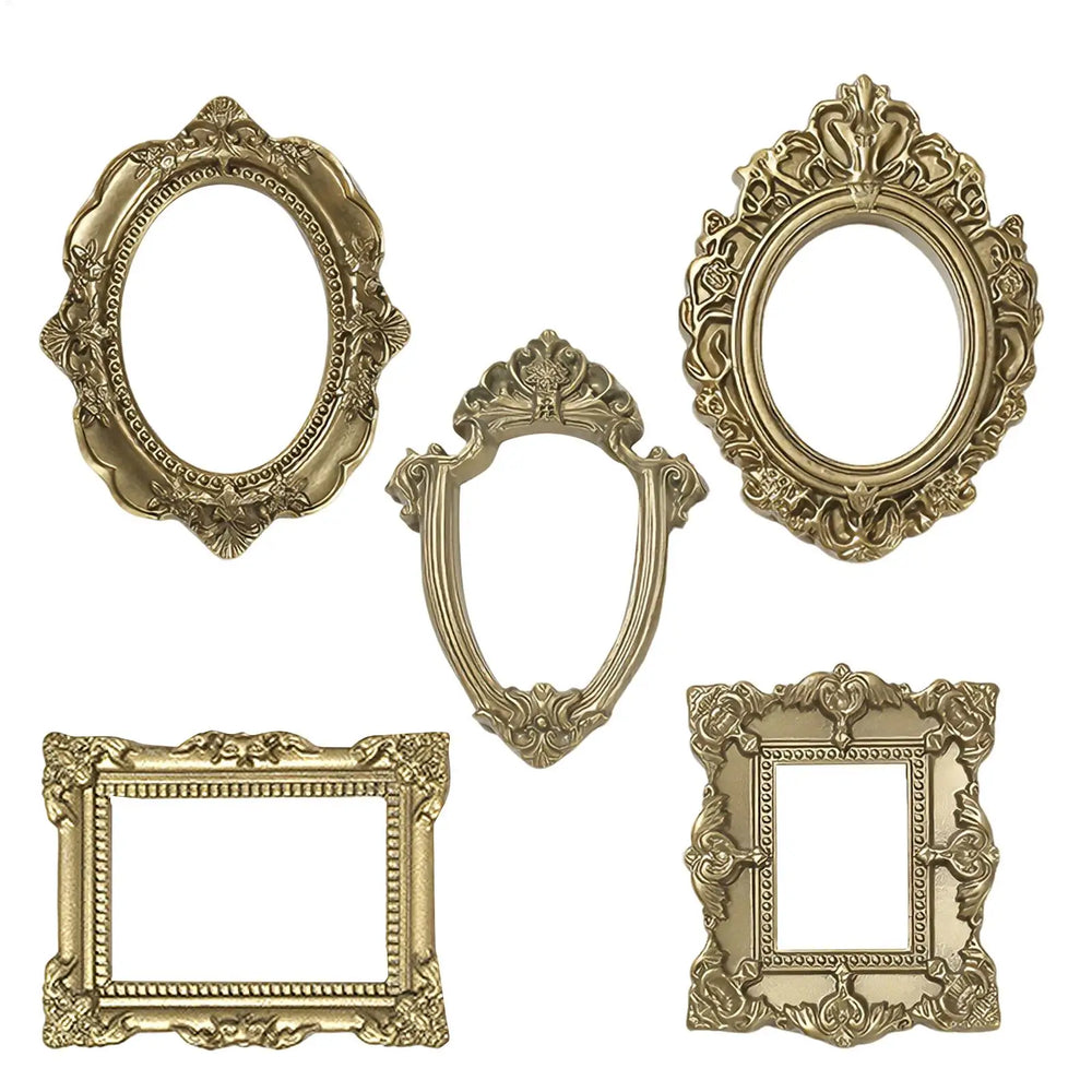 The five empty gold frames laid out, showing the open picture windows and each silhouette