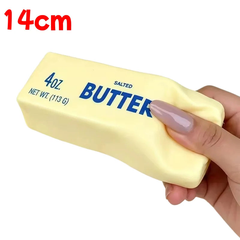 Yellow Butter 14cm being squeezed out of shape