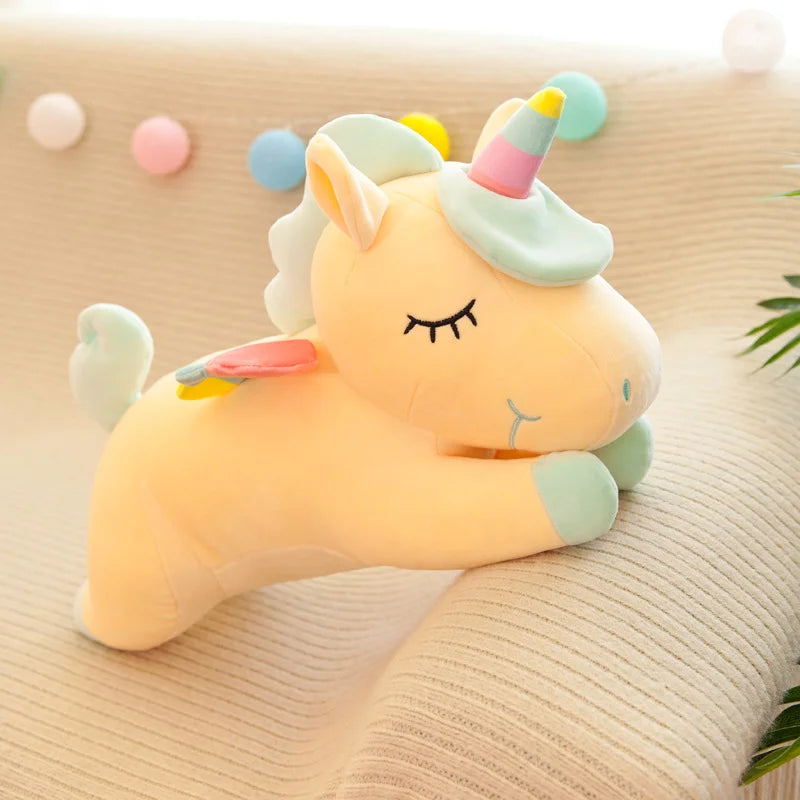 The cream yellow unicorn with a mint and pink mane