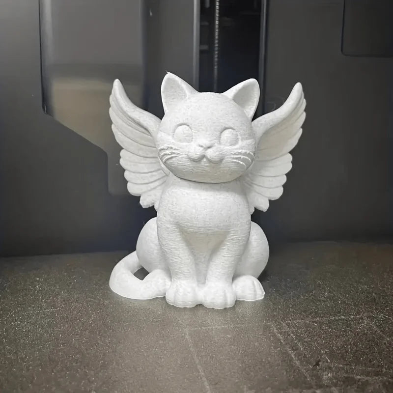 Estatua de gato ángel con alas
