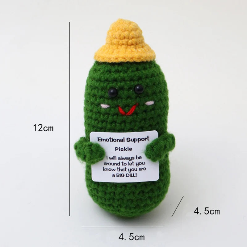 Crochet positive affirmation doll holding an encouragement card