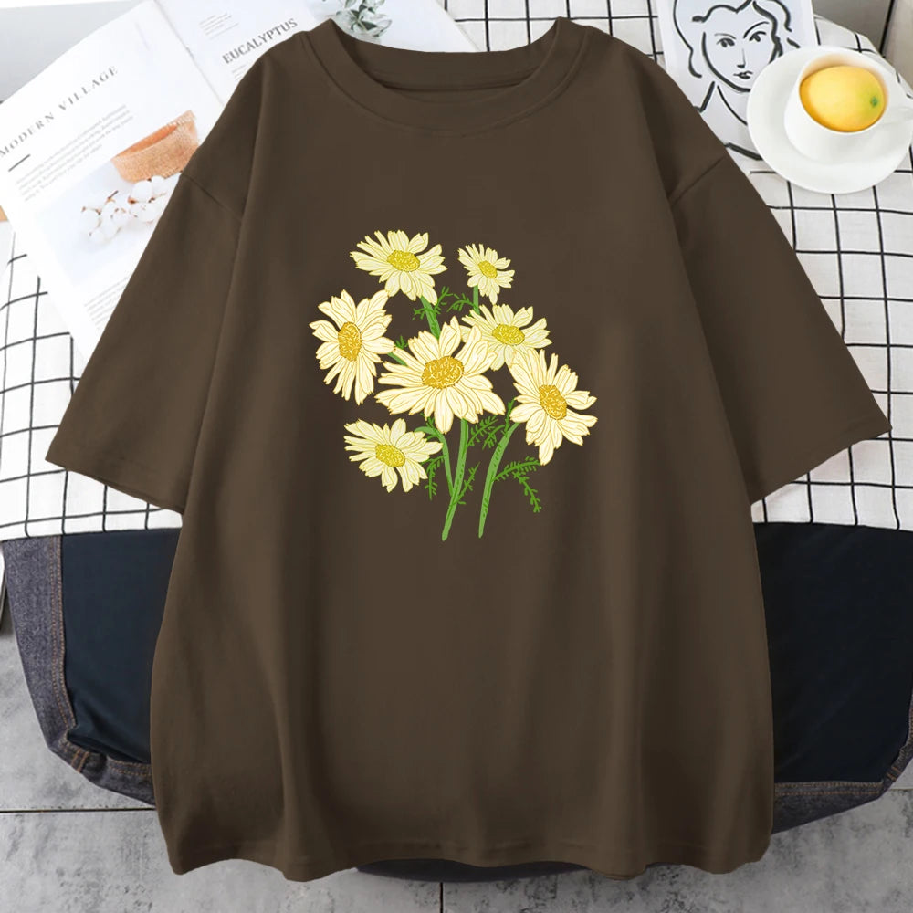 Brown short-sleeve cotton t-shirt printed with a bouquet of yellow and cream daisy-like chrysanthemums