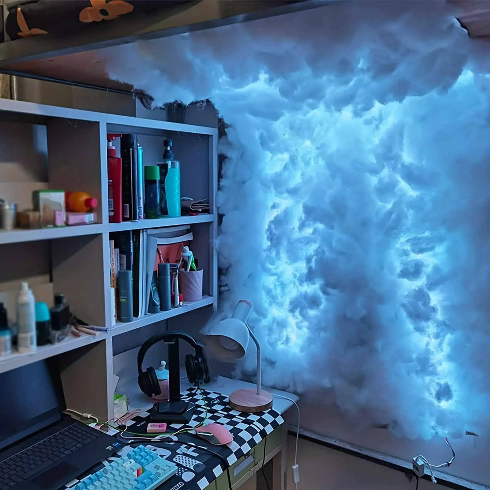 Blue-lit cotton cloud running along a bedroom ceiling above a bookshelf