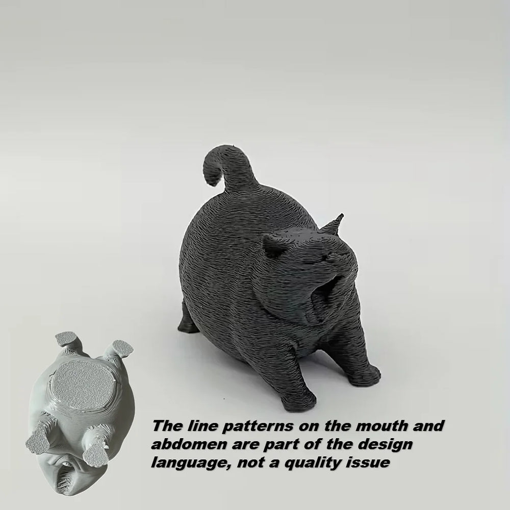 Estatua de gato bostezando como decoración de escritorio