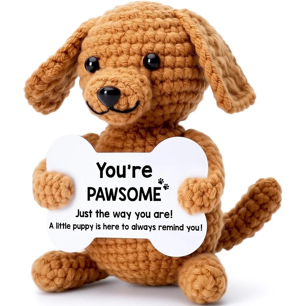 Crochet positive affirmation doll holding an encouragement card