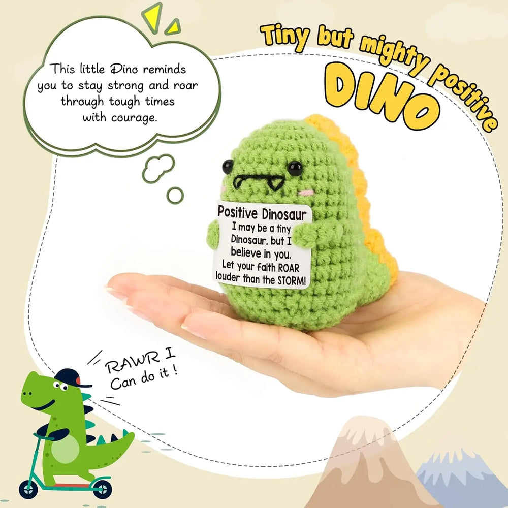 Crochet positive affirmation doll holding an encouragement card