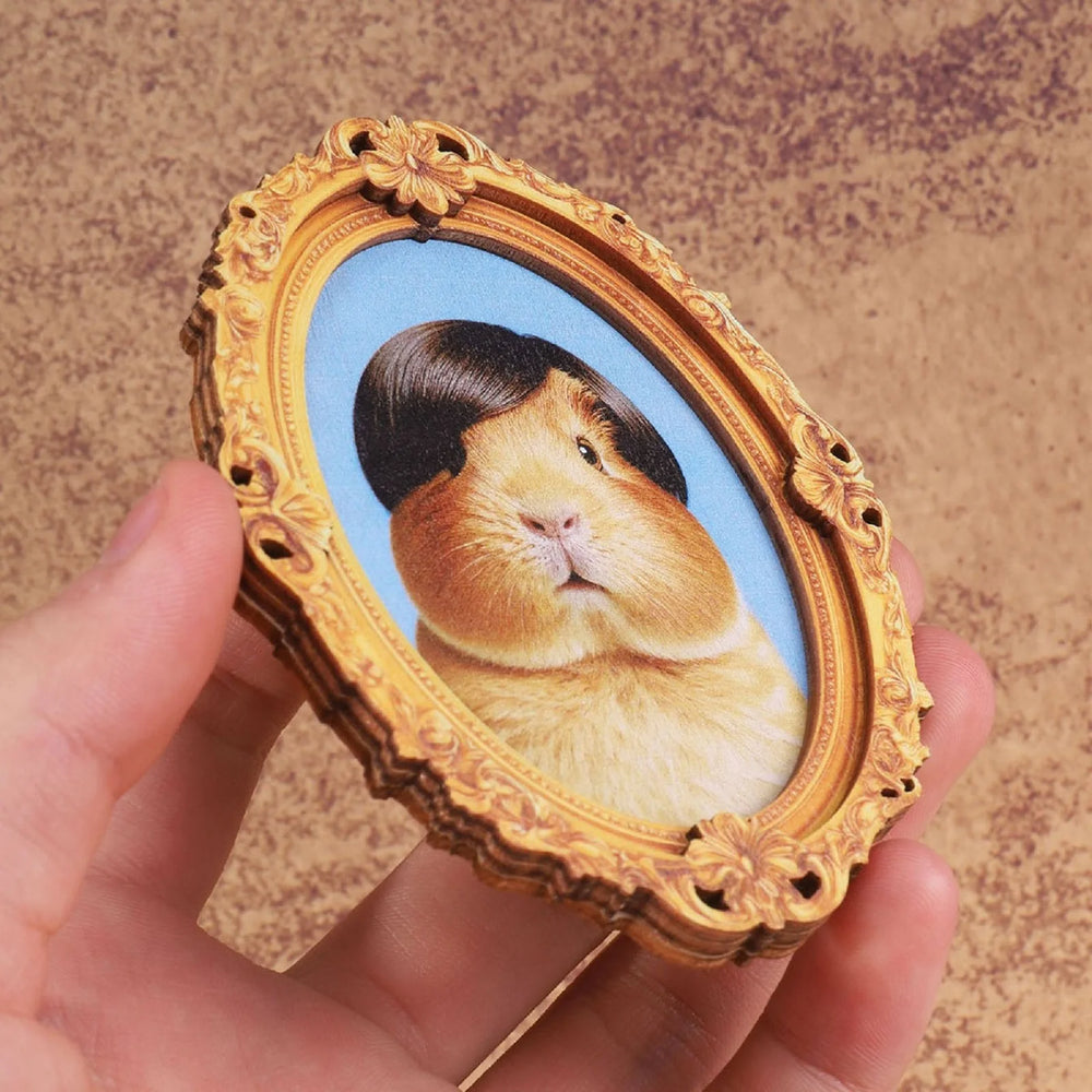 Angled view of the guinea pig framed magnet showing the moulded frame relief