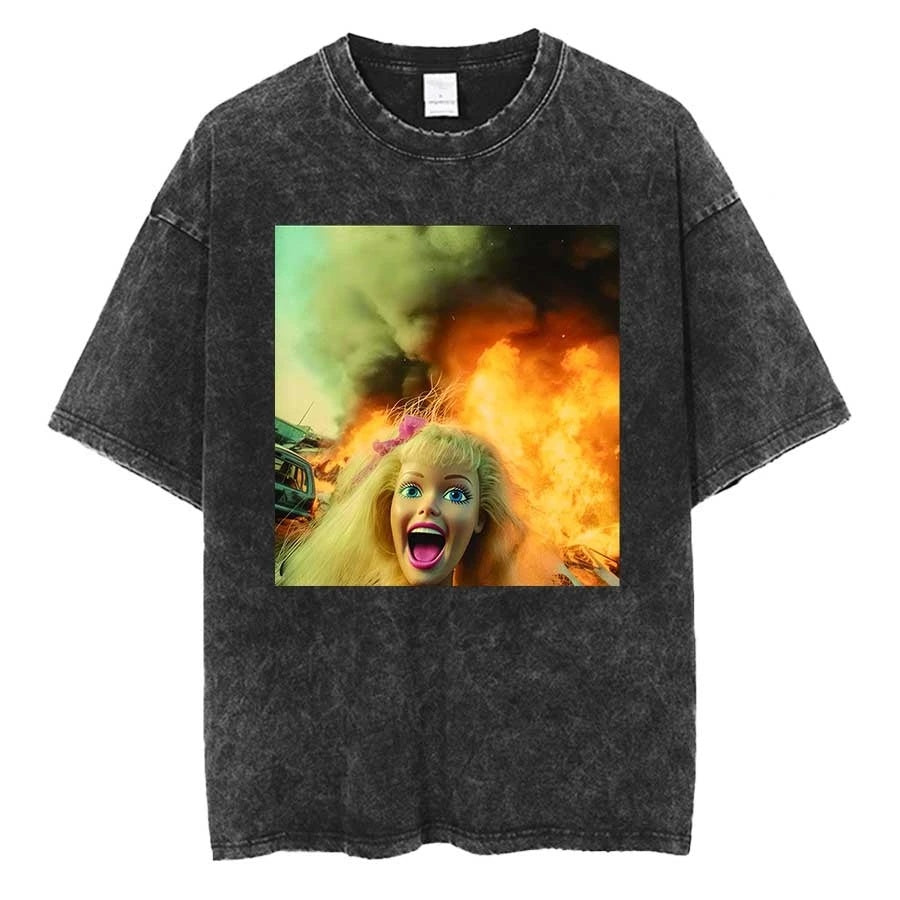 Washed charcoal oversized tee printed with a blonde doll head screaming, mouth wide open, against orange flames and green smoke