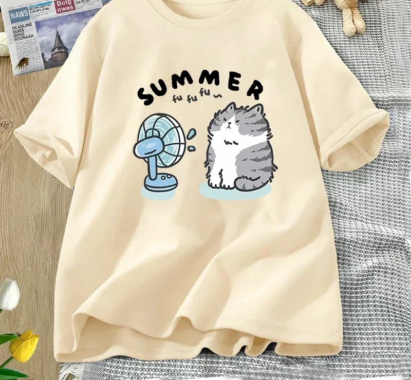 Summer cat and fan tee in khaki, chest print of a cartoon cat cooling off in front of an electric fan