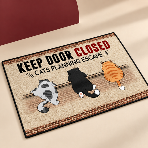 Cats Planning Escape Door Mat on The Weird Store studio background